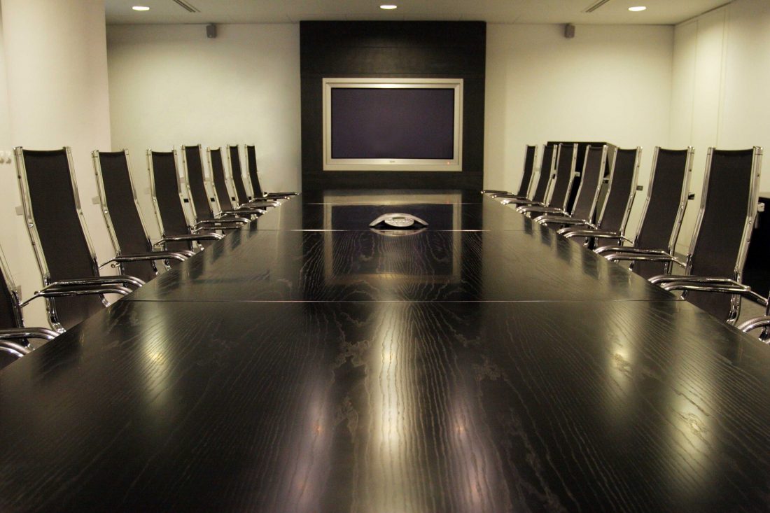 A business meeting reviewing work together